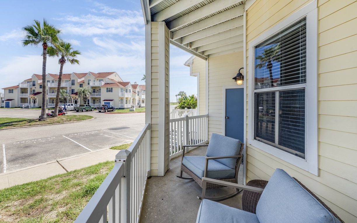 Relax on your private balcony with comfortable seating and tropical palm views. The perfect spot to unwind after exploring.
