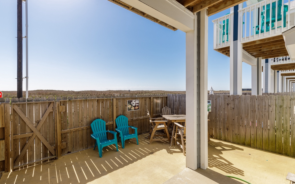 Relax on your private patio with comfortable seating and BBQ grill, perfect for morning coffee or evening meals outdoors.
