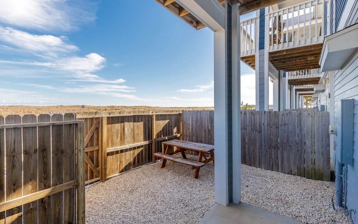 Your private patio offers peaceful outdoor dining with a picnic table, perfect for morning coffee or evening meals under open skies.