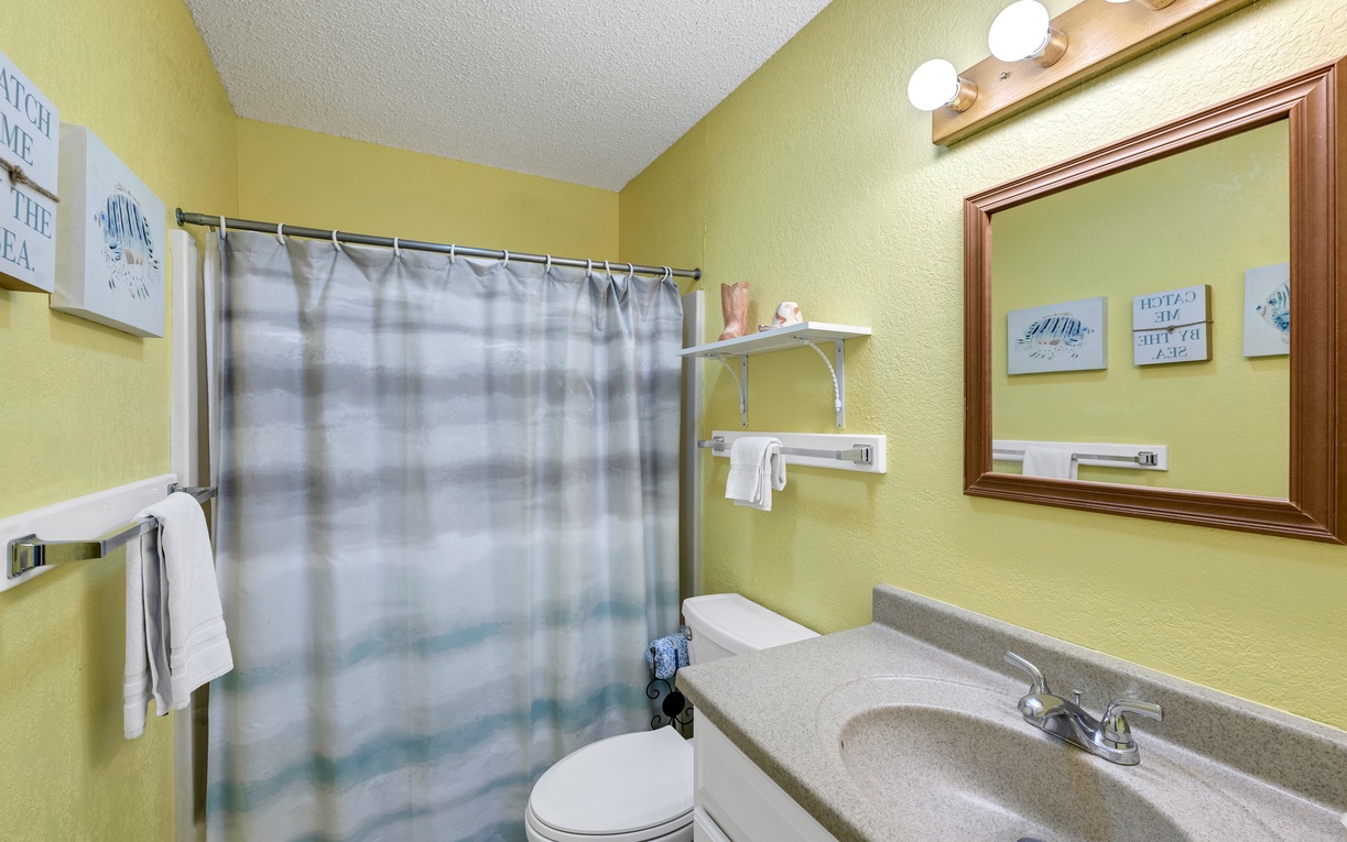 Freshen up in your bright, cheerful bathroom with a spacious vanity and relaxing shower.