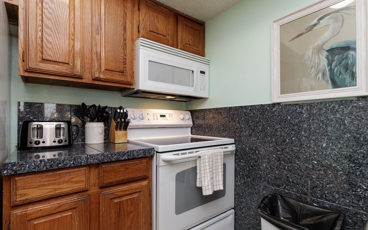 Your fully equipped kitchen features granite counters, oak cabinets, and everything you need to create memorable meals together.