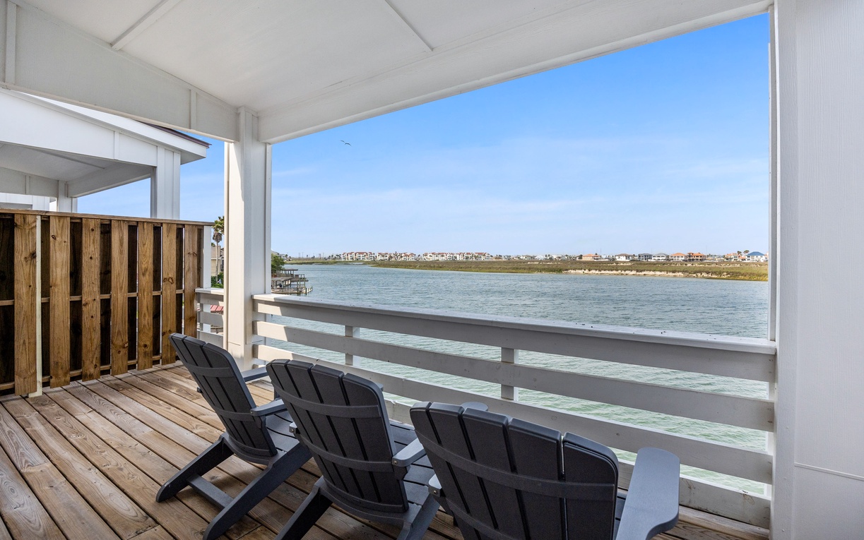 Step onto your private balcony and sink into comfortable chairs while endless water views stretch before you.