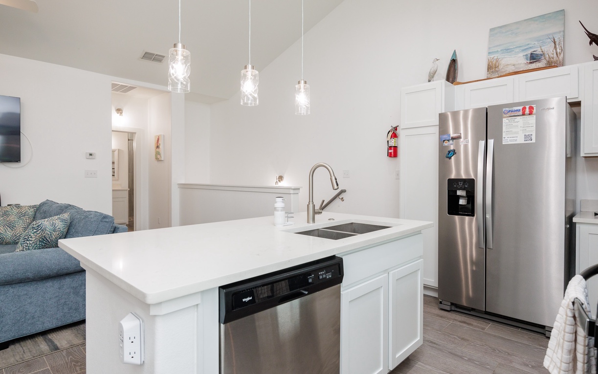 Your modern kitchen island awaits with stainless steel appliances and stylish pendant lighting for memorable meal prep.
