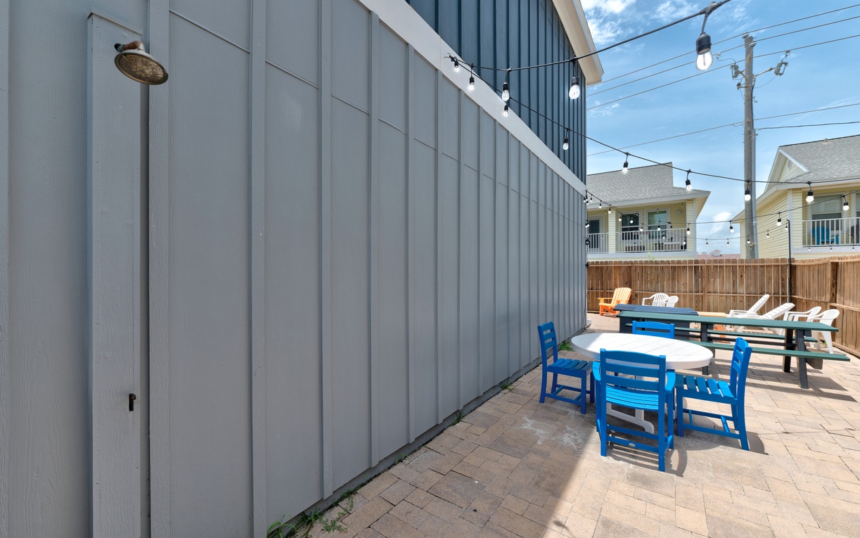 Outdoor shower off the patio space for extra convenience rinsing off after the beach.