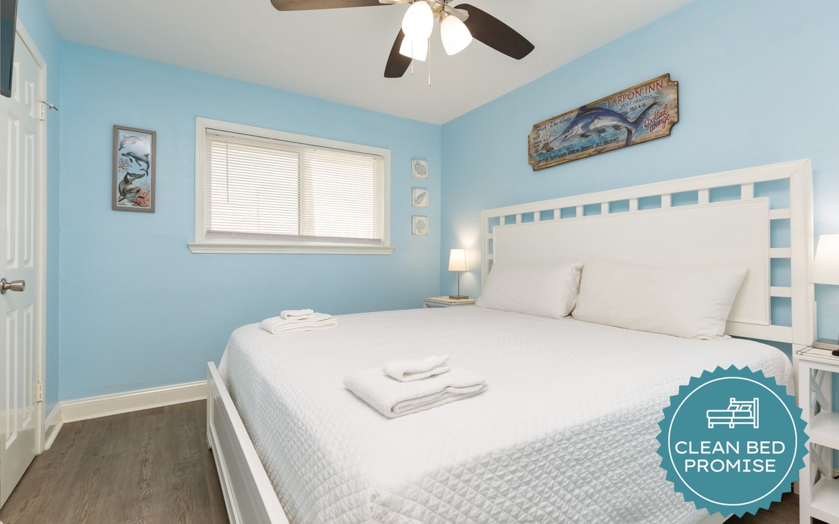 Your peaceful bedroom features crisp white linens and coastal blues, creating the perfect seaside sanctuary for restful nights.