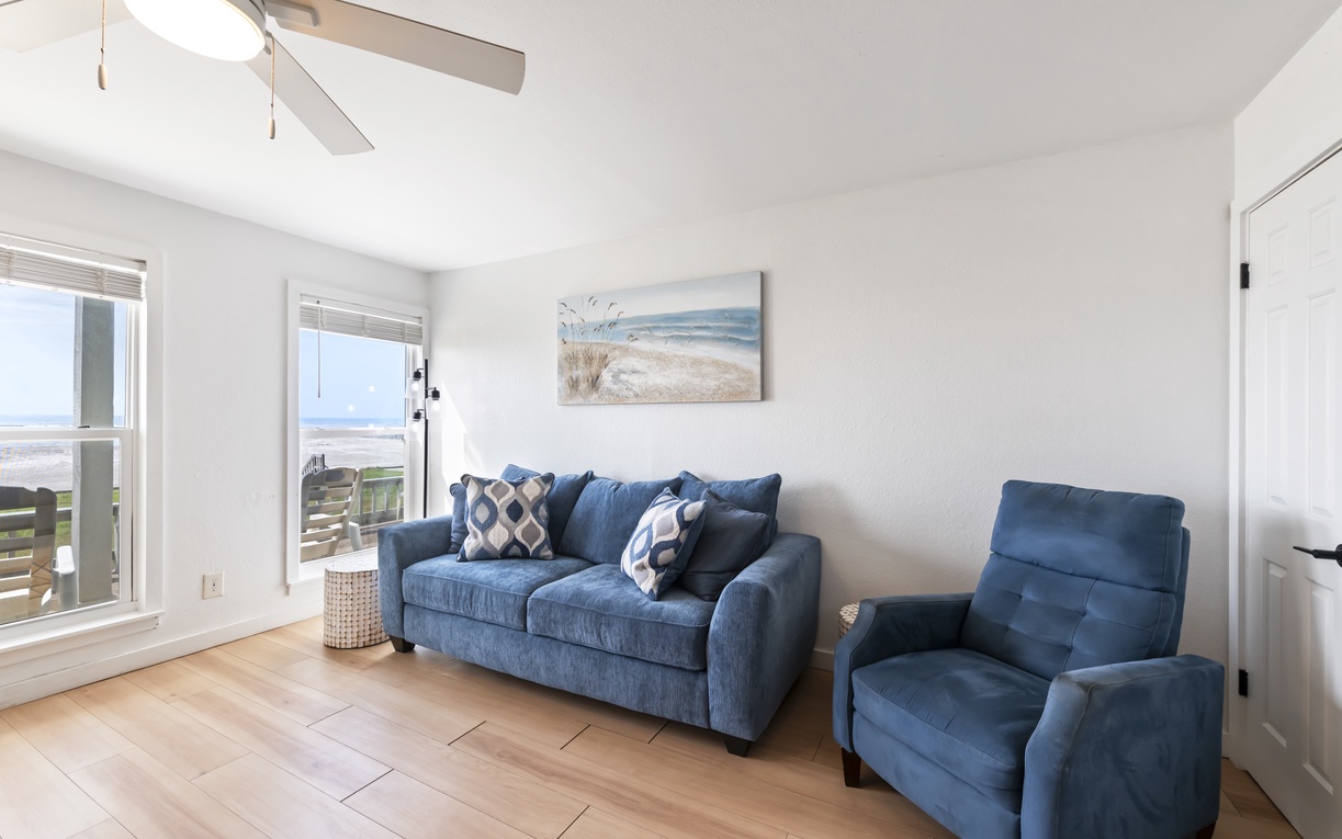 Unwind in your bright, coastal living room with ocean-view windows, plush seating, and gentle sea breezes—pure relaxation awaits you.