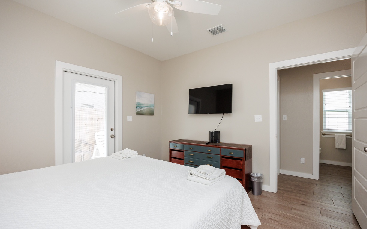 Unwind in your peaceful bedroom with a king size bed, crisp linens, modern TV entertainment, and an ensuite bathroom steps away.