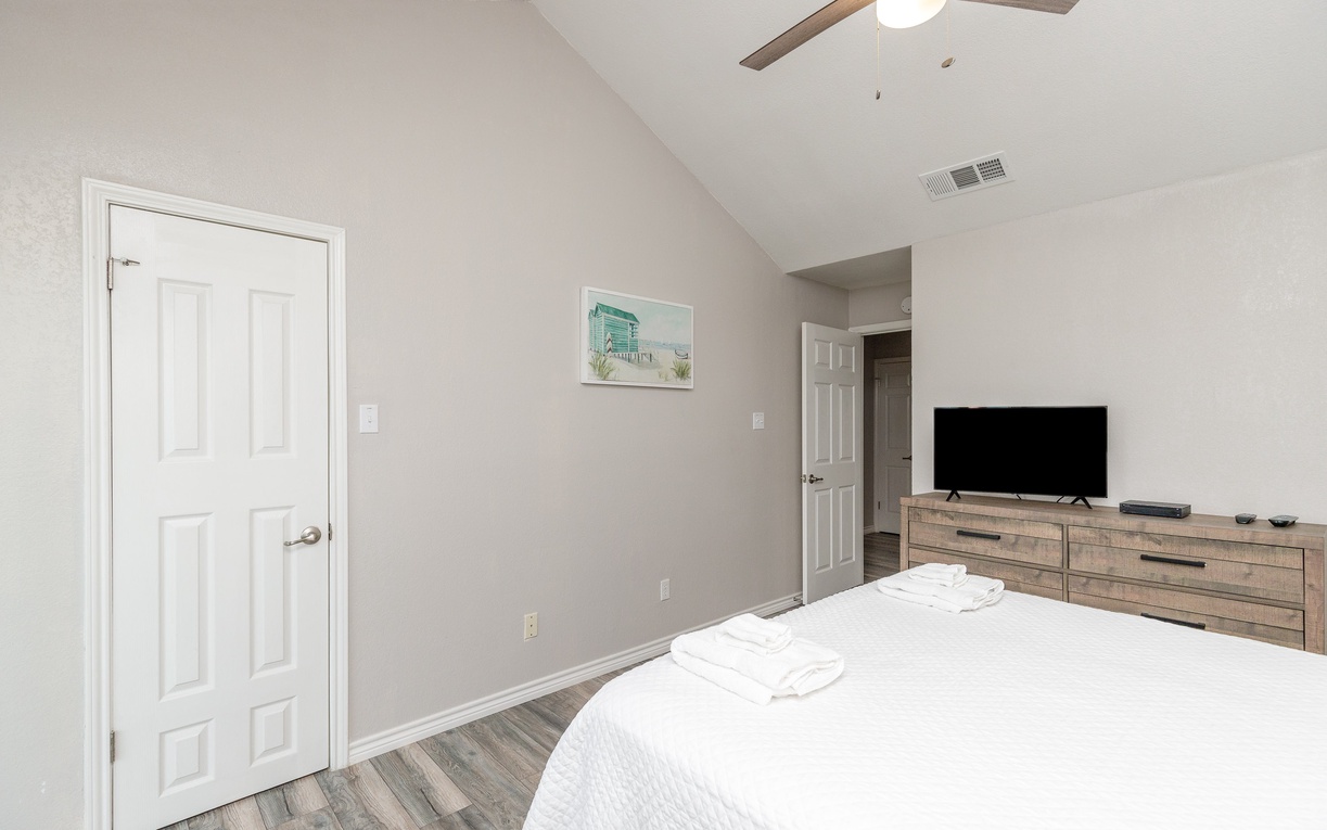 Drift into peaceful sleep in your cozy bedroom, complete with crisp linens and modern amenities for ultimate comfort.