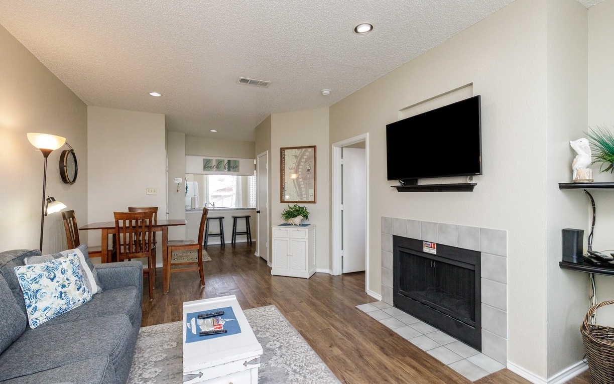 Unwind in this stylish living space where comfort meets convenience—cozy up by your fireplace while enjoying modern amenities and open-plan living.