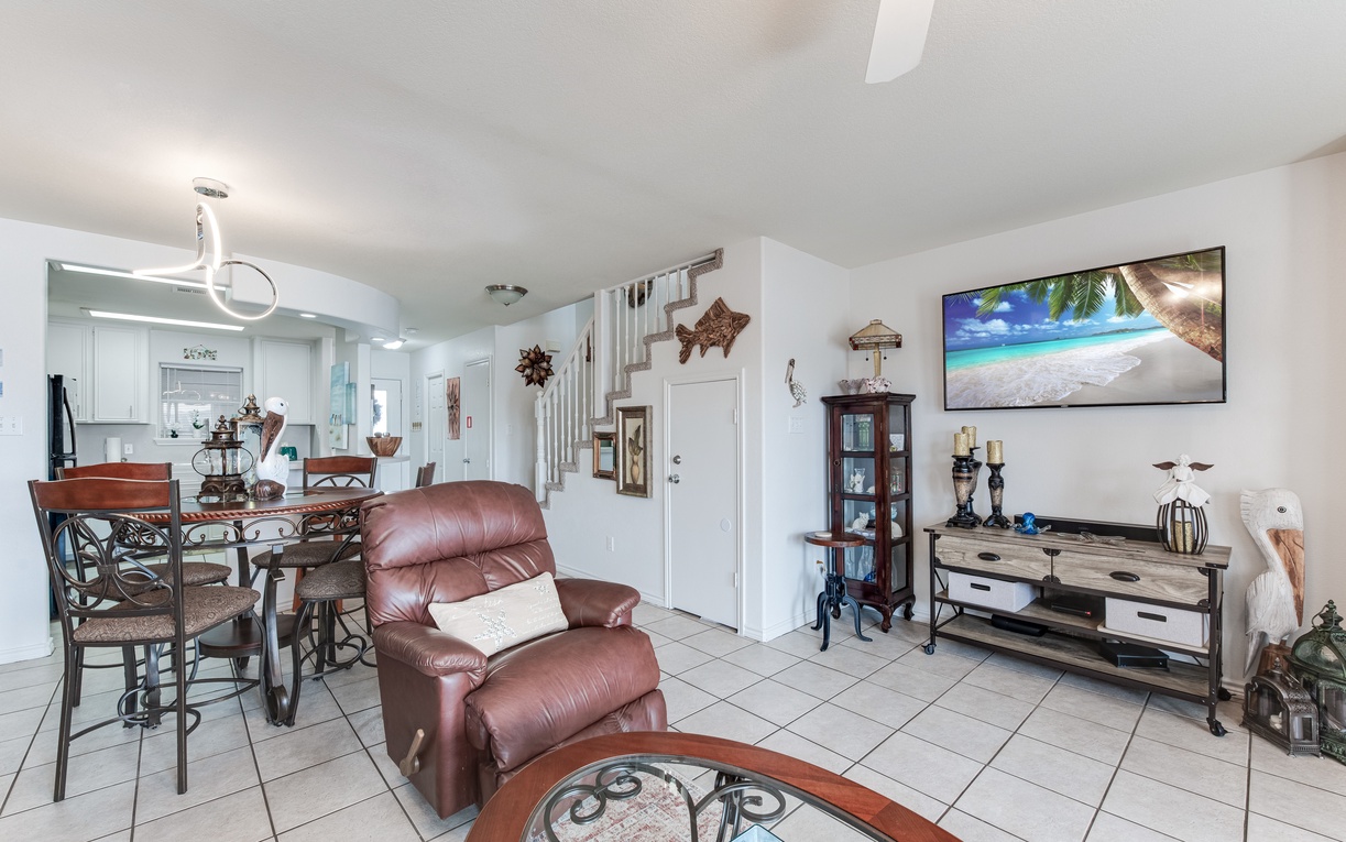Relax in your spacious living area with comfortable leather seating and tropical coastal decor that instantly puts you in vacation mode.