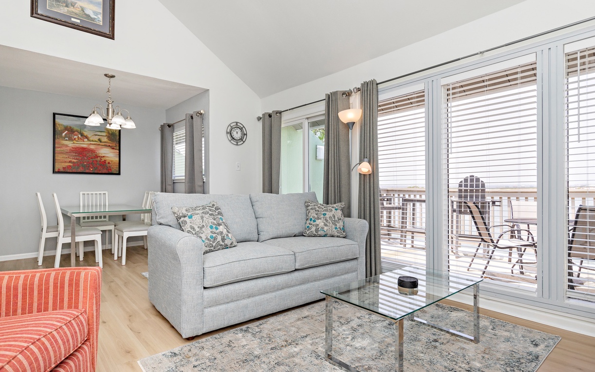 Relax in your bright, contemporary living space with comfortable seating and glass doors that open to your private balcony.