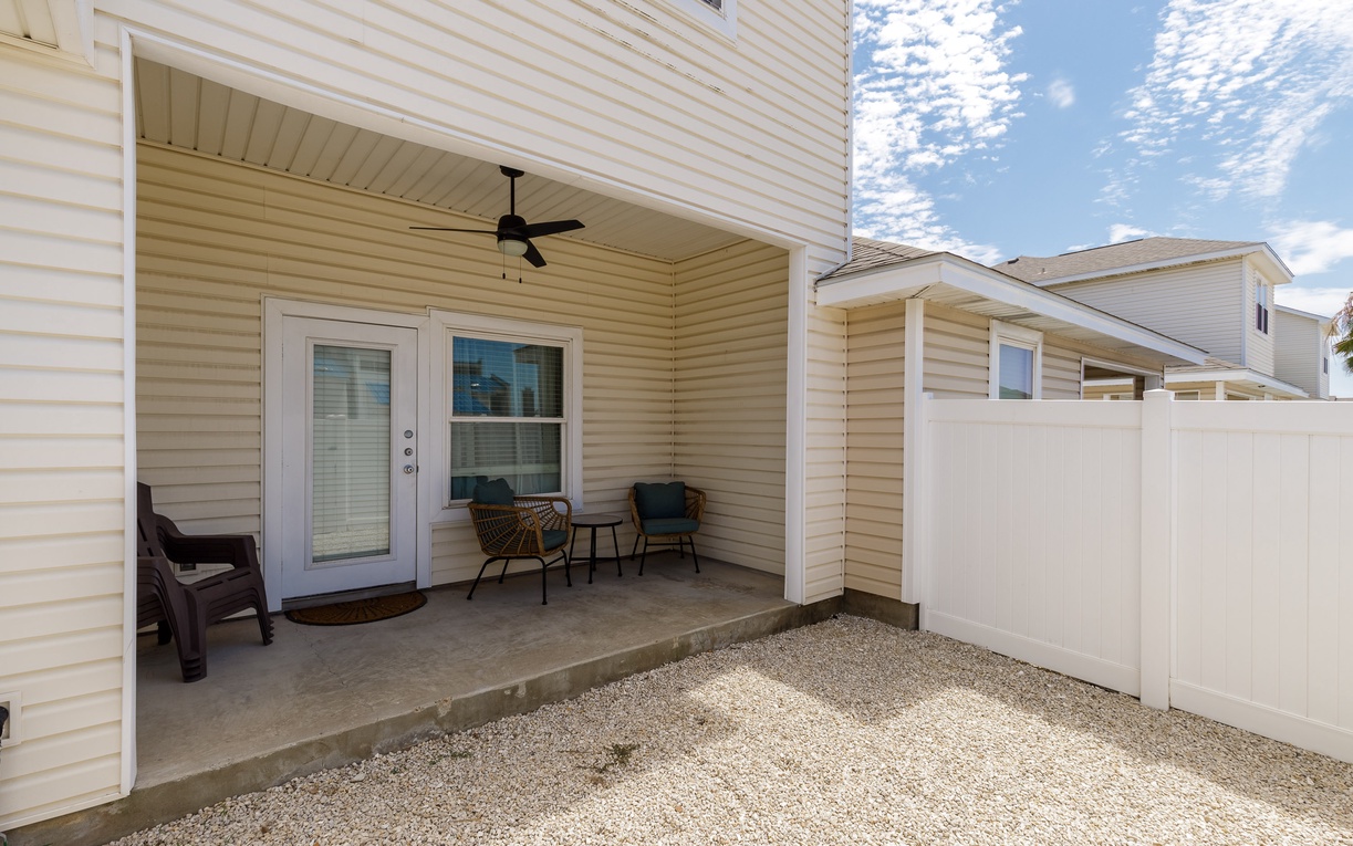 Your private covered patio offers the perfect retreat, complete with comfortable seating and a ceiling fan for those warm afternoons.