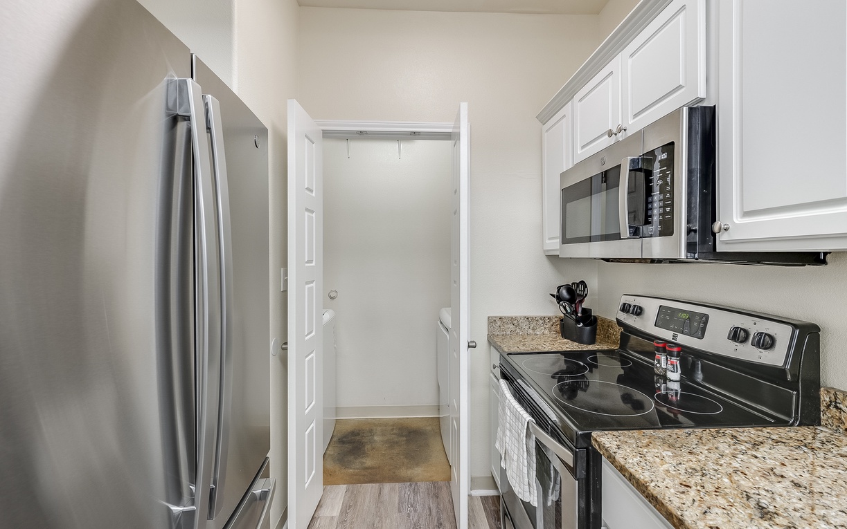 Your fully equipped kitchen awaits with granite counters, stainless steel appliances, and everything needed for home-cooked meals during your stay.