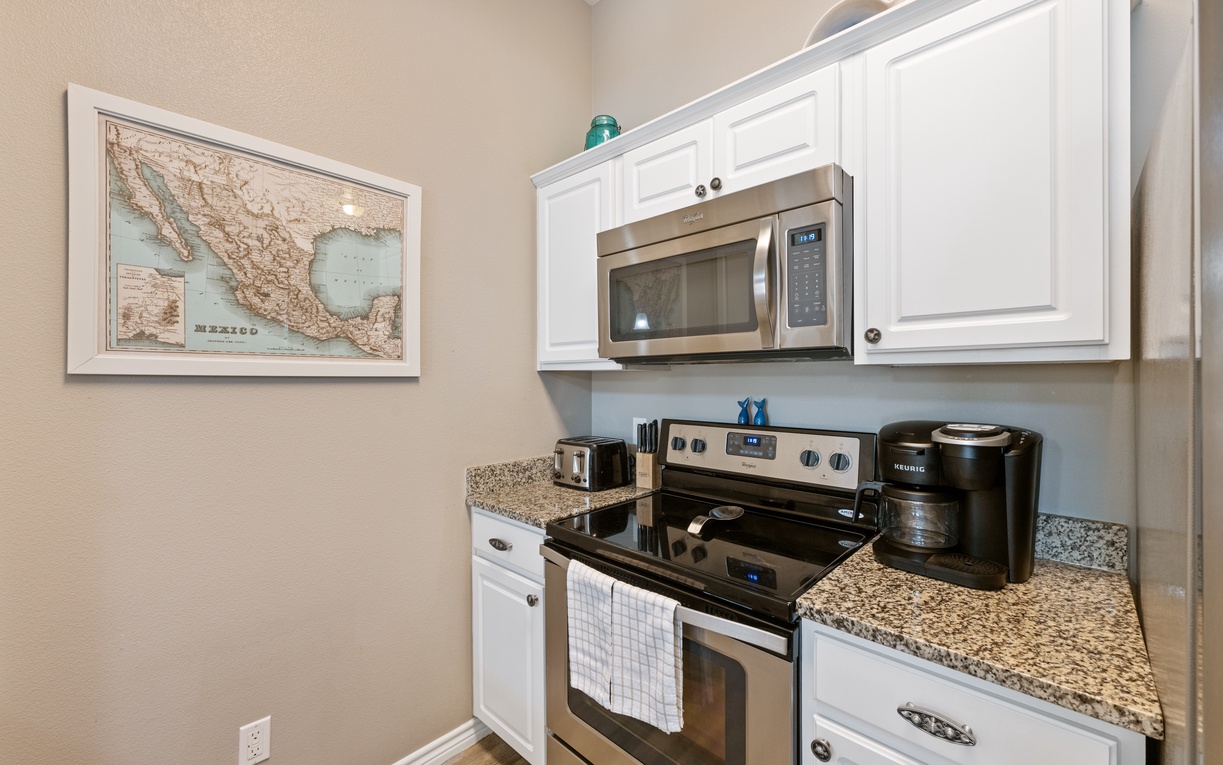 Your fully equipped kitchen awaits with granite counters, stainless appliances, and everything you need to create memorable meals together.