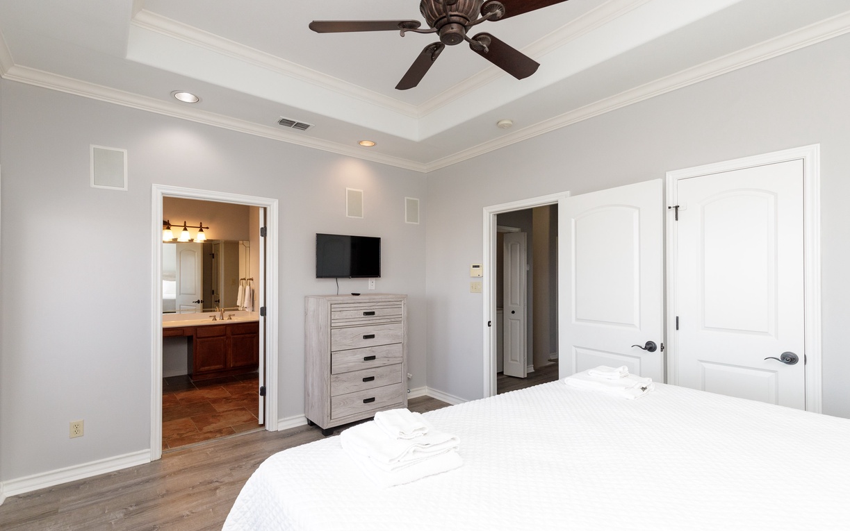 Drift into restful sleep in your serene bedroom, complete with ceiling fan, entertainment, and ensuite bathroom for ultimate comfort.