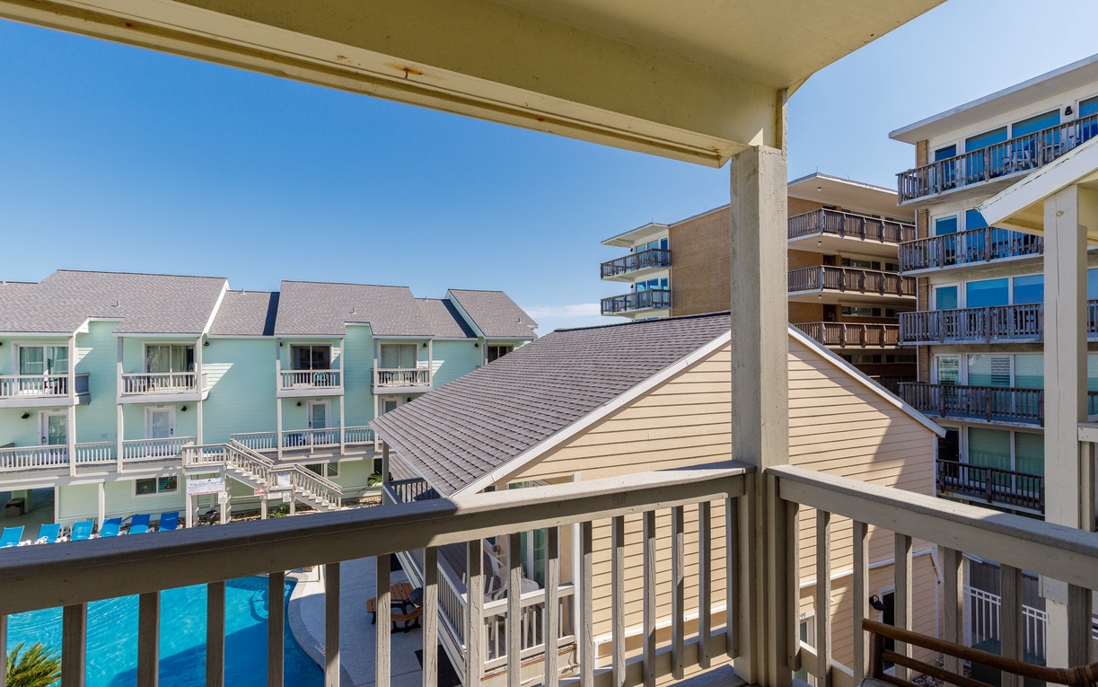 Step onto your private primary bedroom balcony and soak in the vibrant resort atmosphere.