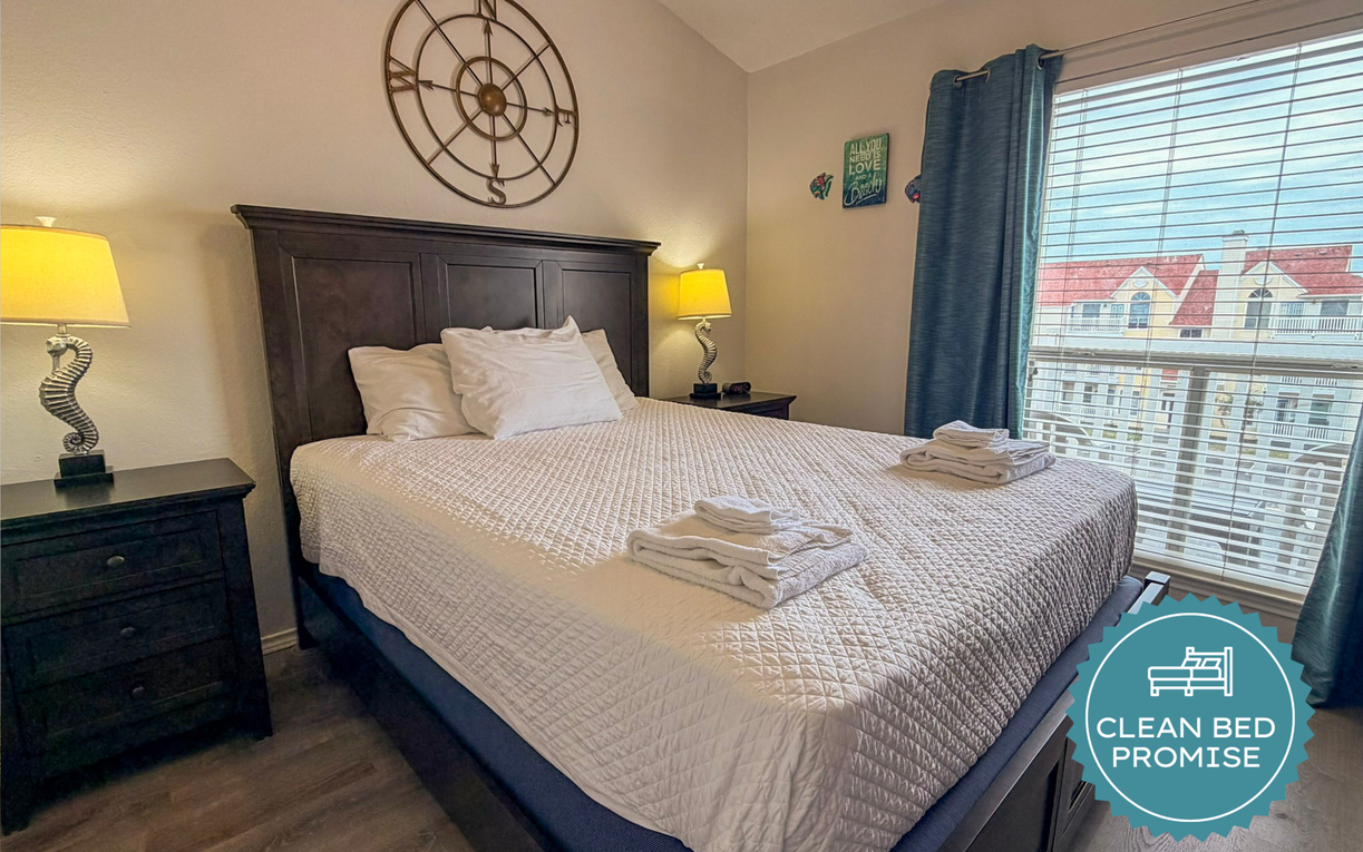 Sink into this cozy bedroom with a plush bed, warm lighting, and charming touches that make you feel right at home.