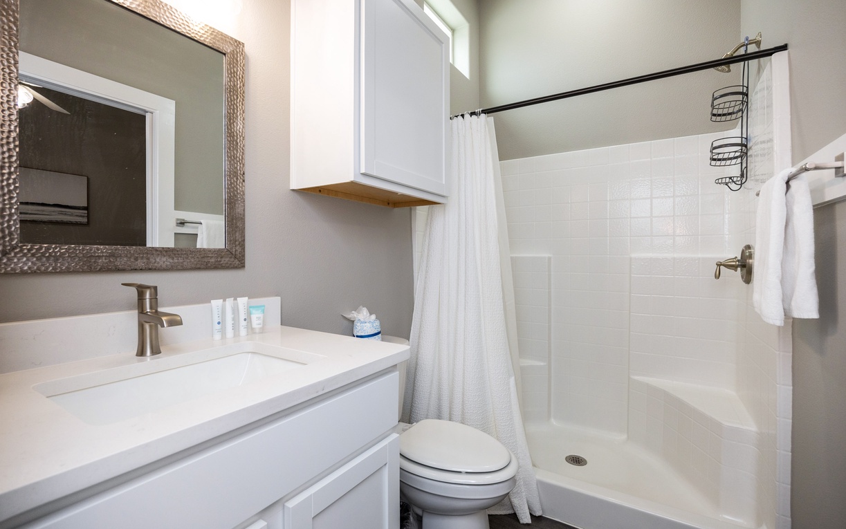 Step into your private bathroom featuring a spacious shower, modern vanity, and thoughtful amenities for a refreshing start to each day.