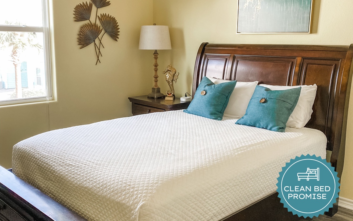 Sink into comfort with crisp white linens and cheerful yellow walls that brighten your mornings. Your peaceful retreat awaits.