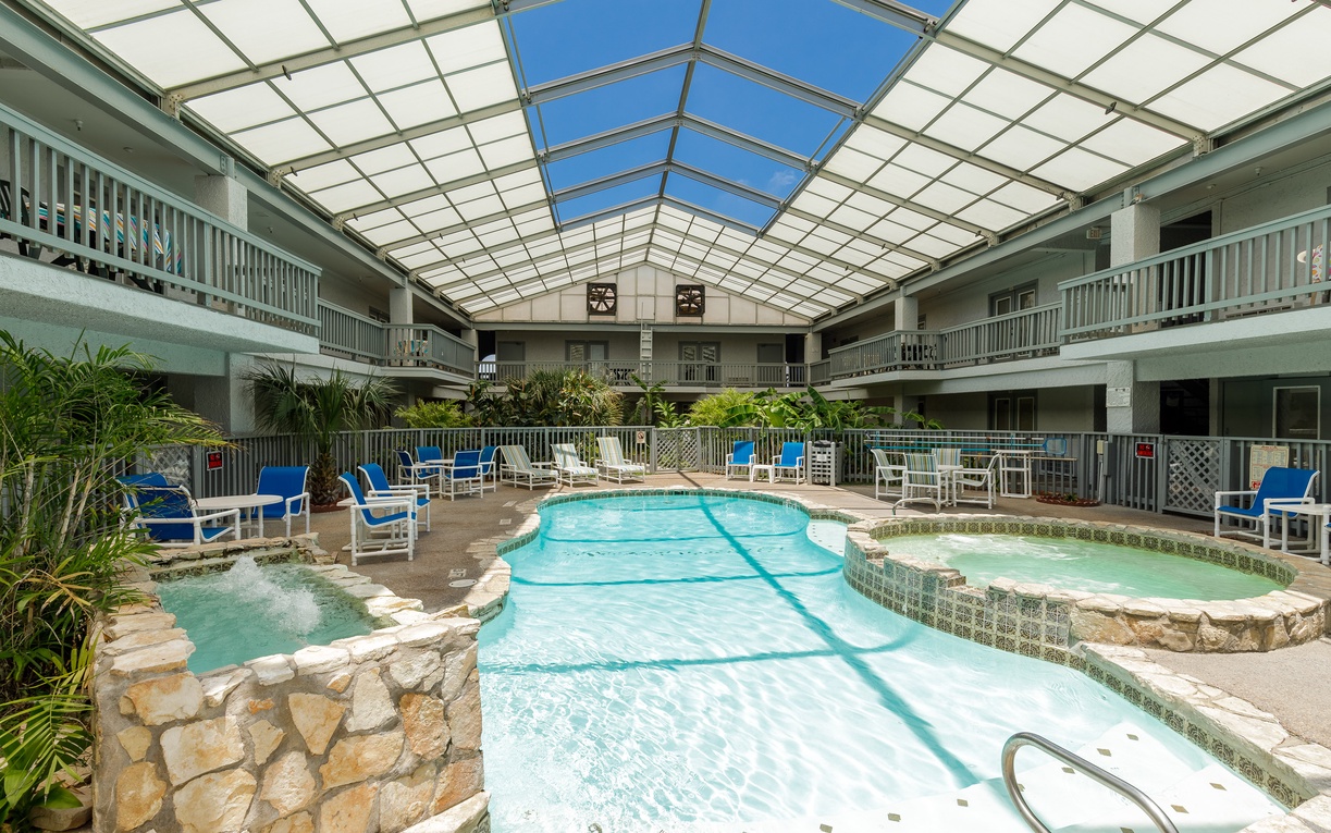 Dive into your own indoor oasis with crystal-clear waters, bubbling spa jets, and tropical plants creating pure relaxation.