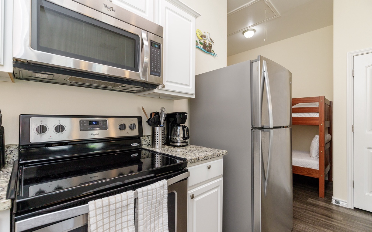 Your fully equipped kitchen makes meal prep a breeze with granite counters, stainless appliances, and everything you need to cook.