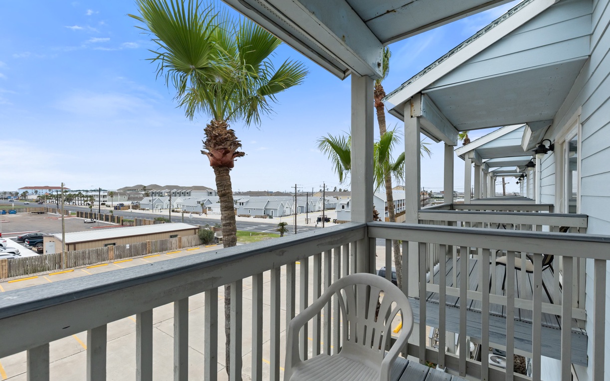 Step onto your private balcony and breathe in the coastal breeze while palm trees sway gently overhead.