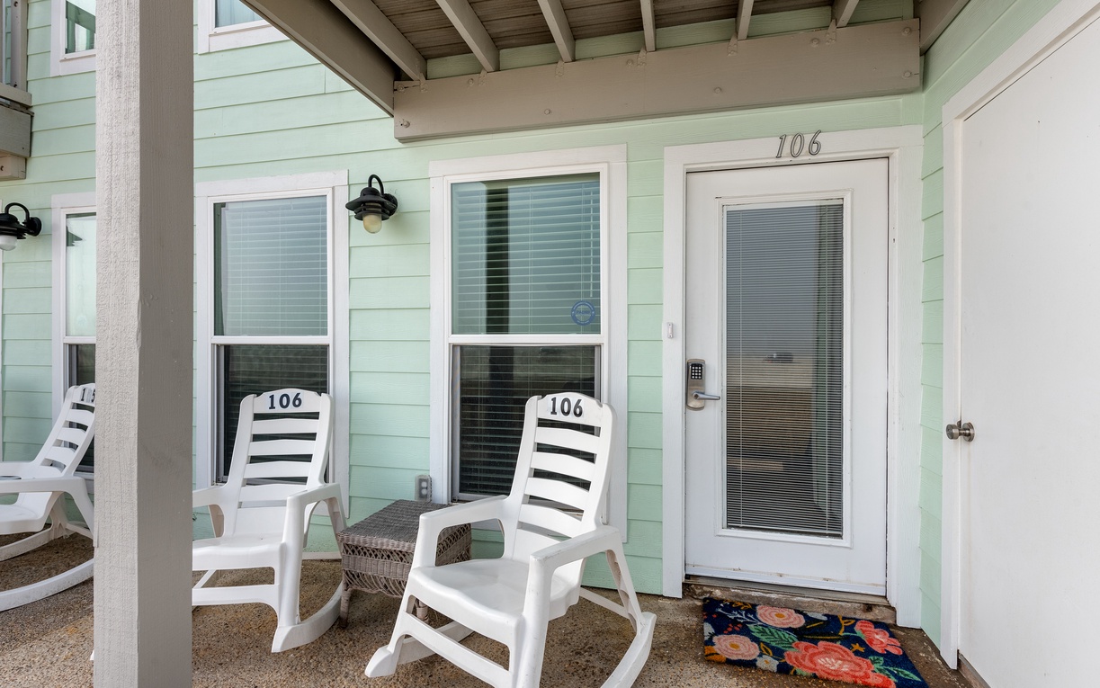 Relax on your private patio with charming rocking chairs, where morning coffee tastes better under this peaceful covered space.