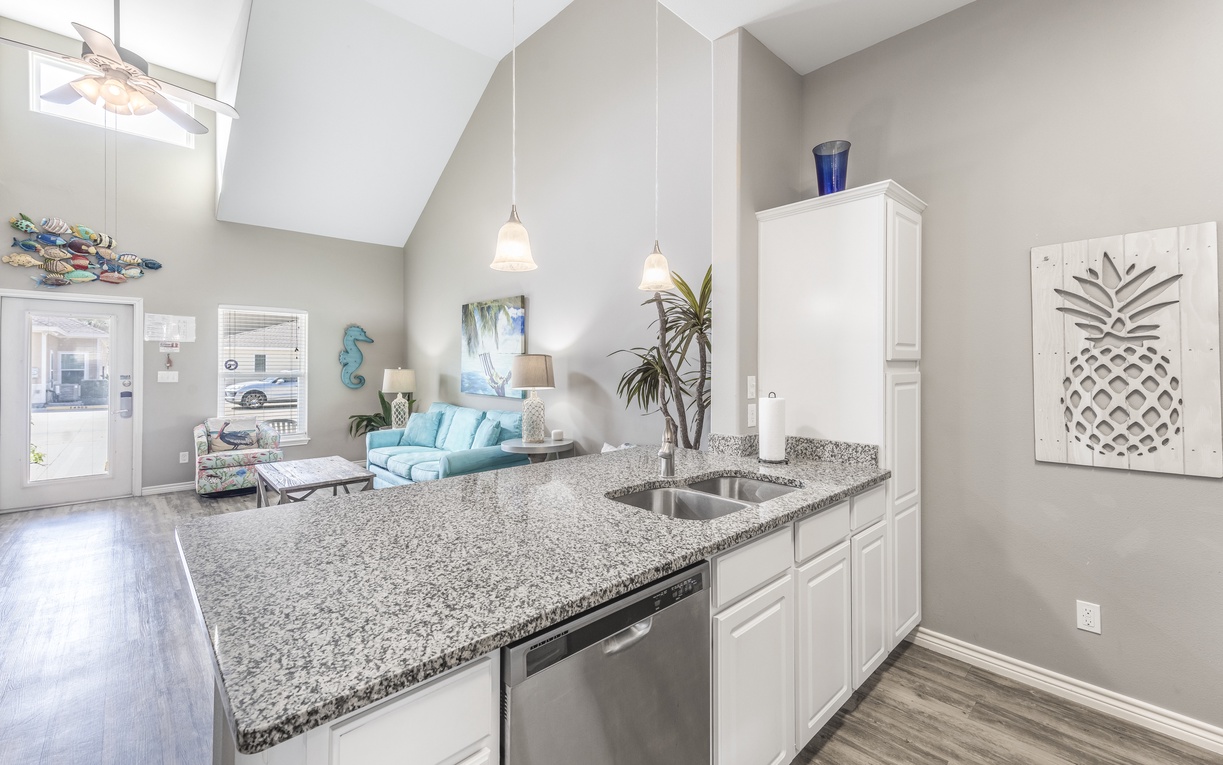 Your spacious kitchen flows into the bright living area, perfect for preparing meals while staying connected with your group.