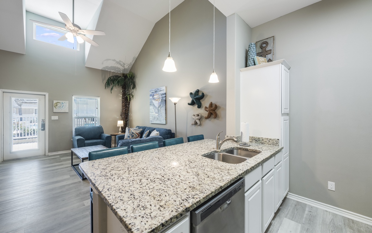 Relax in your open-concept retreat where granite countertops and modern amenities meet comfortable coastal-themed living spaces.