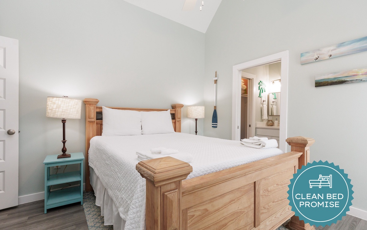 Drift off in your inviting bedroom featuring crisp linens and warm wood accents, with your private ensuite just steps away.