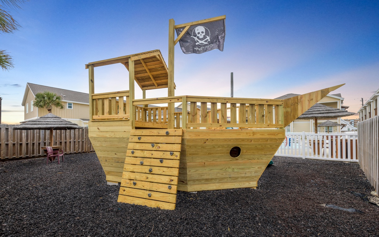 Adventure awaits on this magnificent wooden pirate ship playground where young buccaneers can climb, explore, and create endless memories in your backyard.