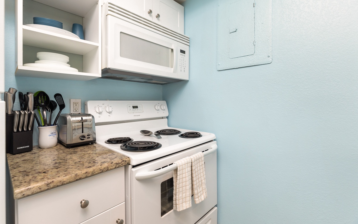 Your fully equipped kitchen invites you to create memorable meals with granite counters, stove, microwave, and everything needed for comfortable cooking.