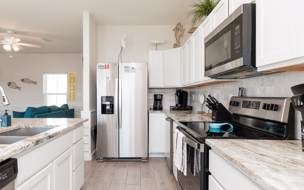 Your fully equipped kitchen awaits with modern appliances, granite counters, and everything you need to create memorable meals during your stay.