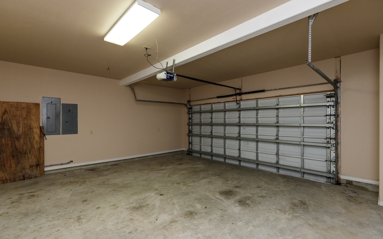 Spacious two-car garage with automatic door opener provides secure parking and extra storage space for your convenience during your stay.
