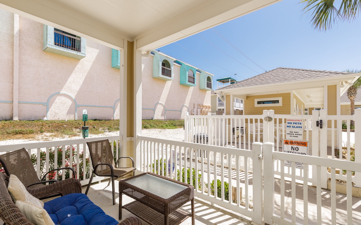Your private covered patio offers comfortable seating where you can unwind while enjoying the tropical breeze and colorful resort surroundings.