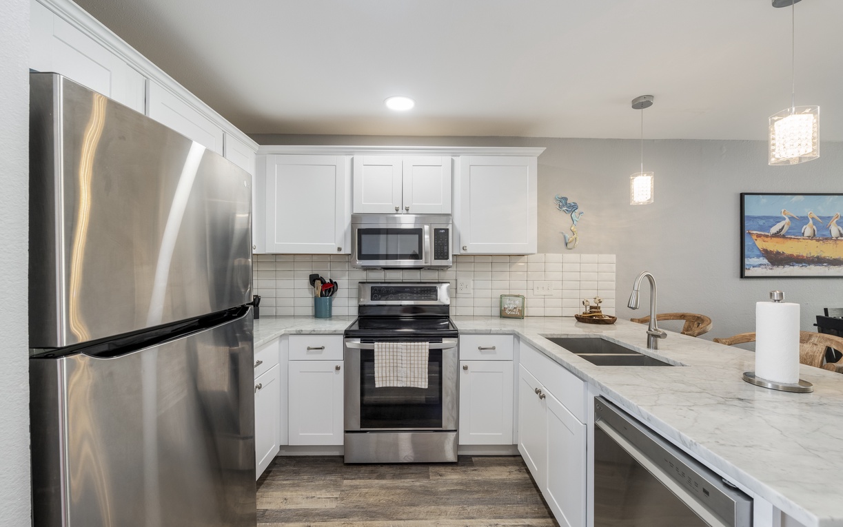 Your fully equipped kitchen features stainless steel appliances and granite counters, perfect for preparing meals during your stay.