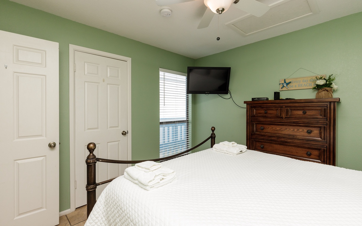 Your guest bedroom features a comfortable queen size bed with fresh linens.