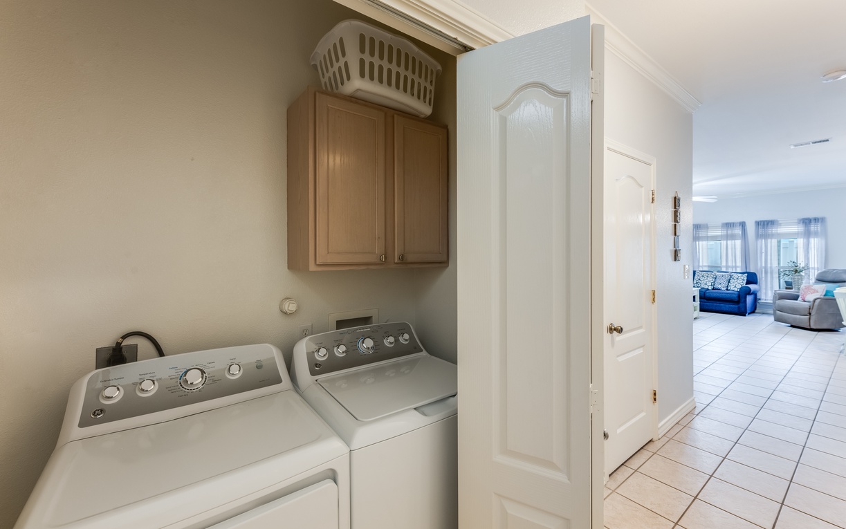 Your private laundry room makes extended stays effortless with full-size washer and dryer plus convenient storage.