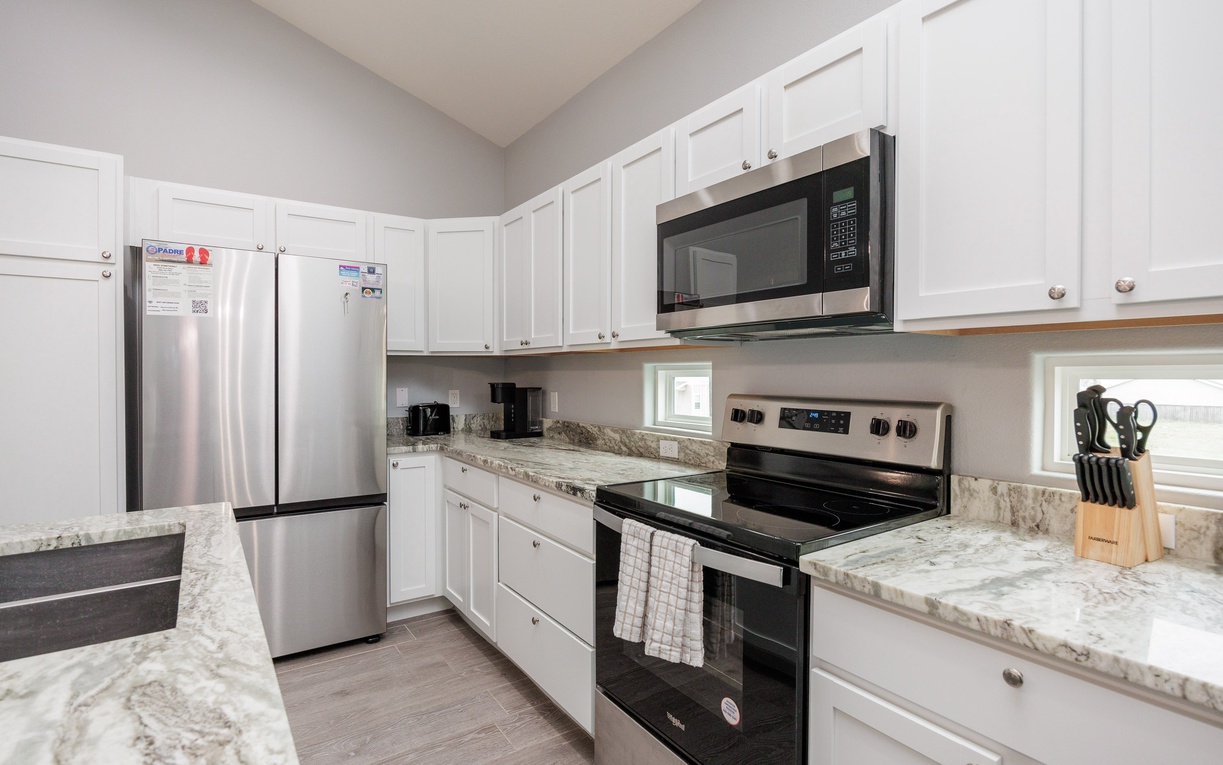 Your fully equipped kitchen features granite counters, stainless steel appliances, and everything you need to cook your favorite meals during your stay.