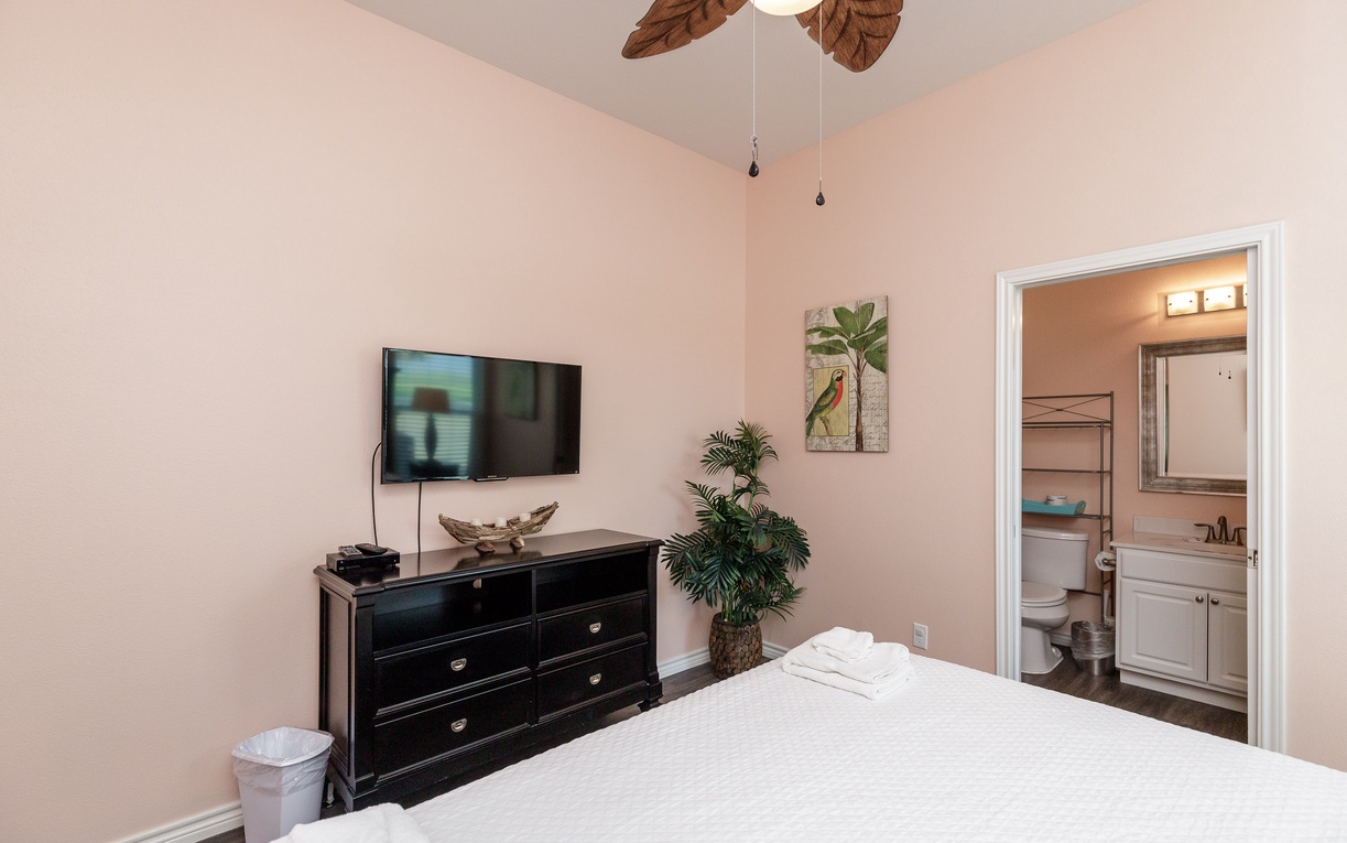 Your primary bedroom features a king size, plus convenient entertainment and an ensuite bathroom for comfort.