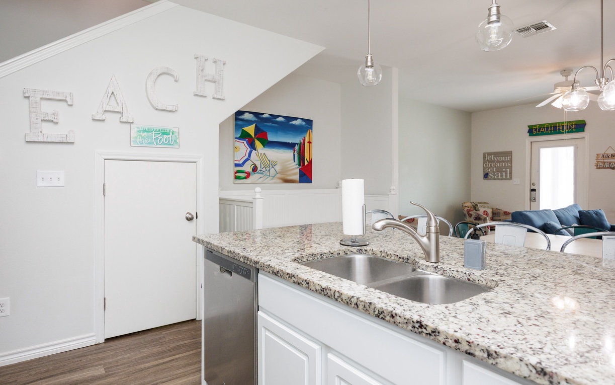 Your stylish open kitchen features granite countertops and modern appliances, flowing seamlessly into the comfortable living space for easy entertaining.