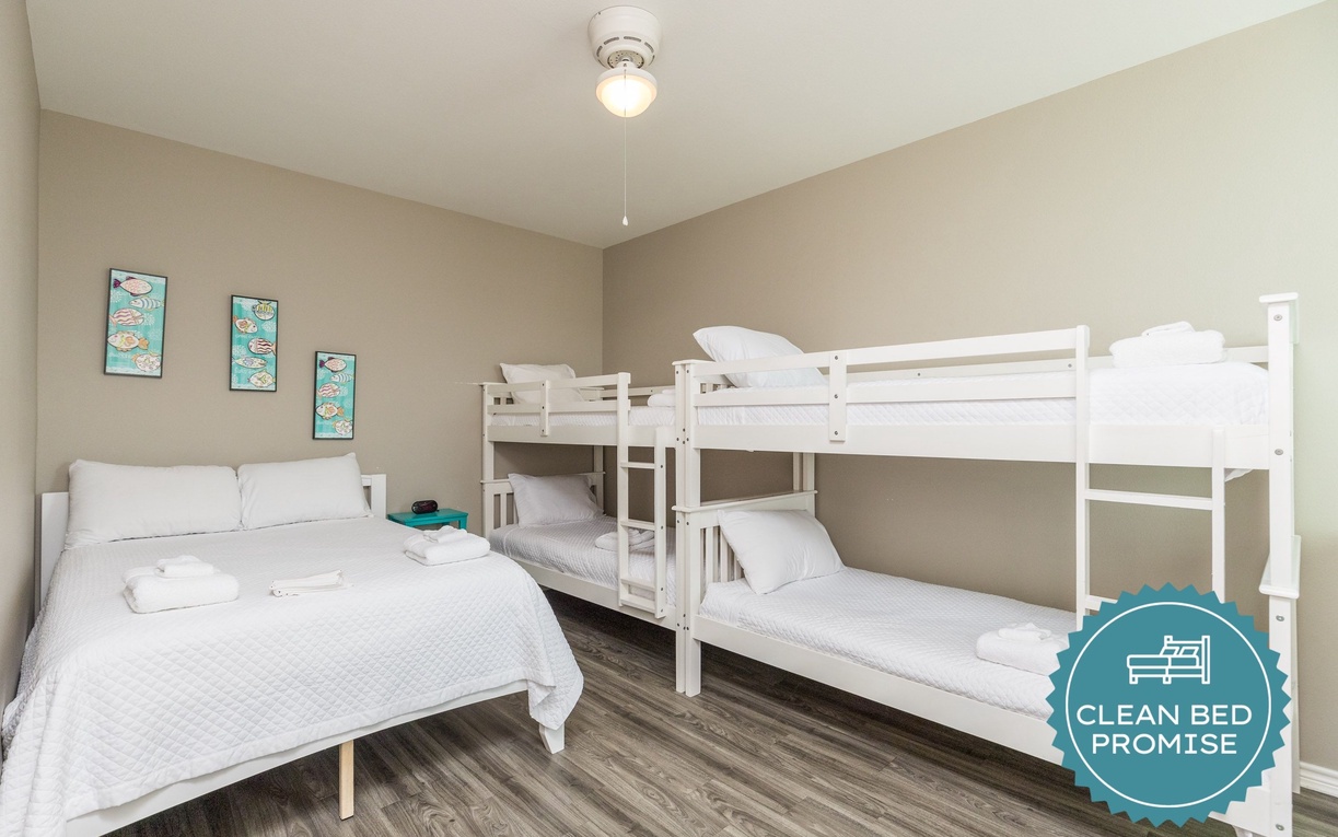 Rest comfortably in this thoughtfully designed bedroom where crisp white linens and warm neutral tones create your perfect retreat.