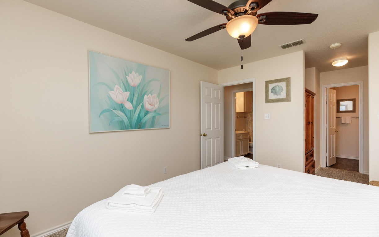 Sink into crisp linens and enjoy the king size bed in the primary bedroom.