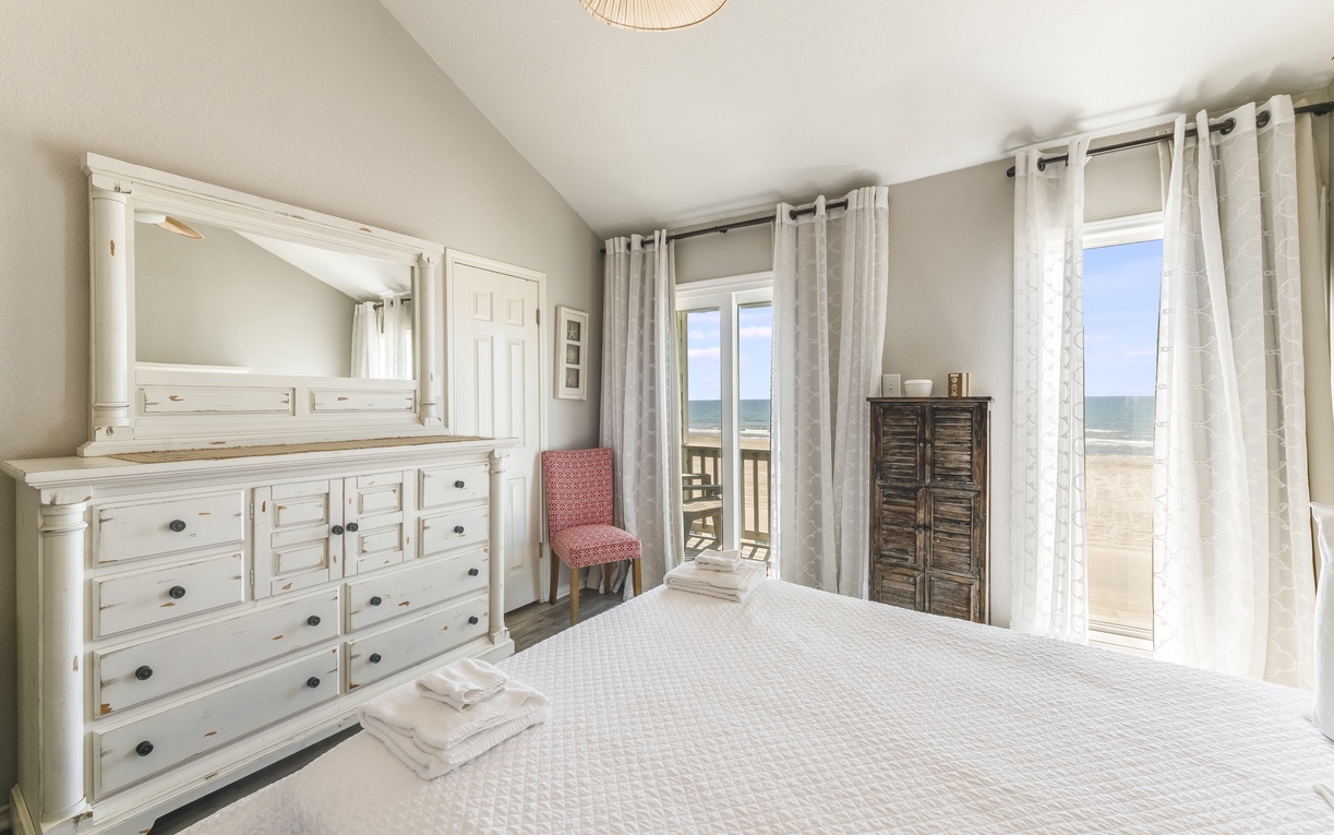Wake up to ocean views from your comfortable bed, with soft linens and coastal furnishings creating the perfect beachfront retreat.
