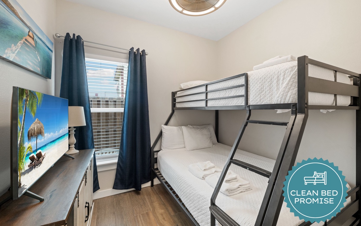 Rest easy in your cozy bunk room, where crisp white linens and thoughtful touches await after a day of adventure. A comfortable retreat perfect for the whole family.