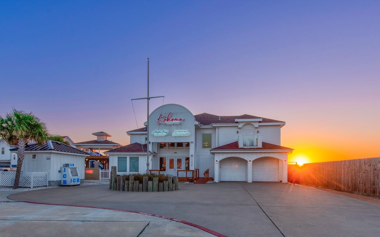Yacht Club featuring stunning sunset views and nautical-themed architecture in a coastal setting.