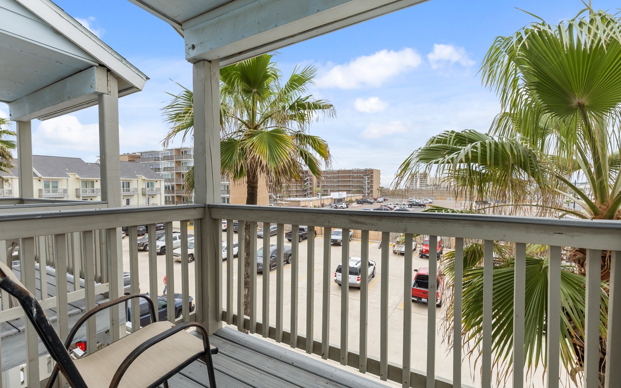 Step onto your private balcony and breathe in the tropical air while palm trees sway gently in the breeze.