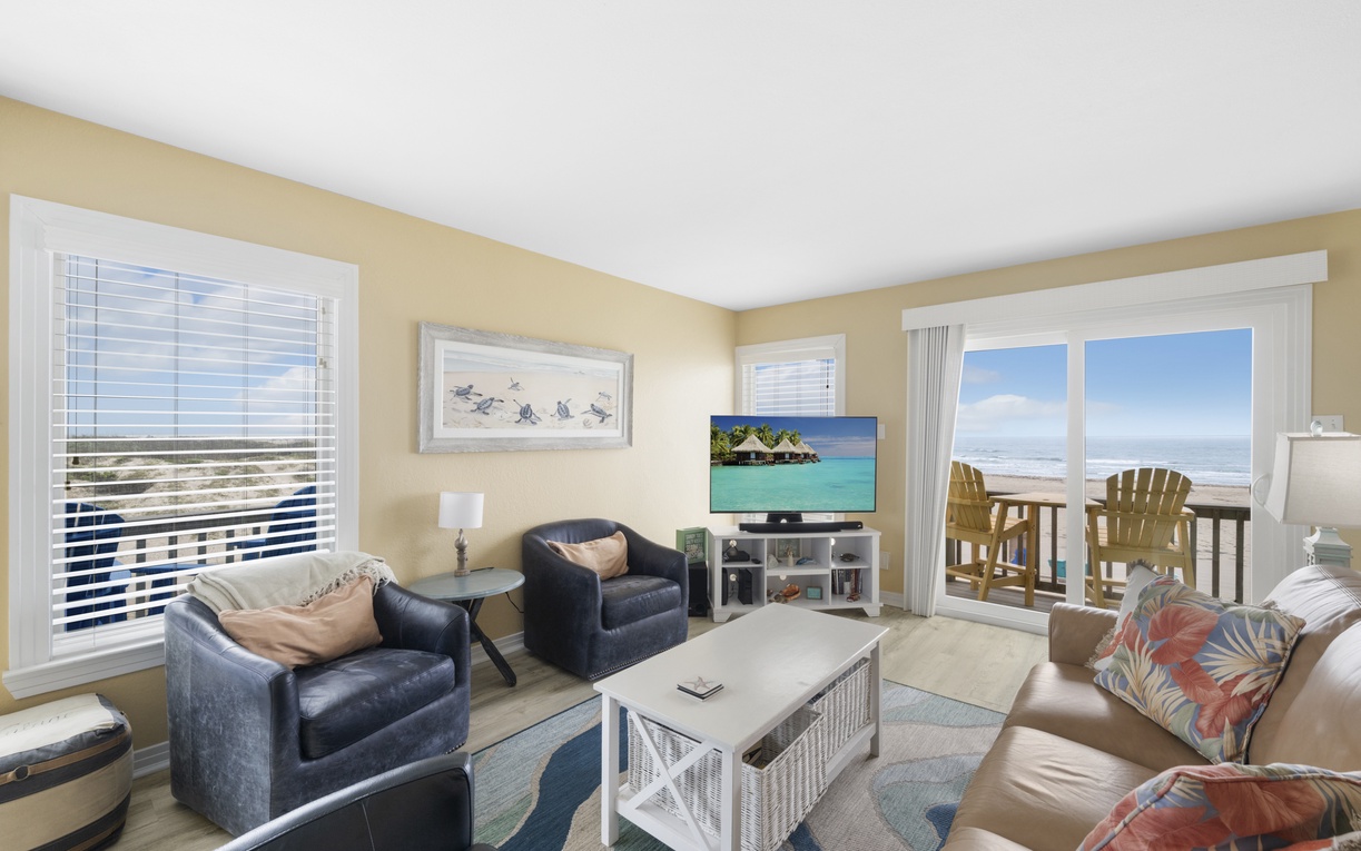 Relax in this bright living room where tropical touches and ocean breezes create your perfect beachside retreat.