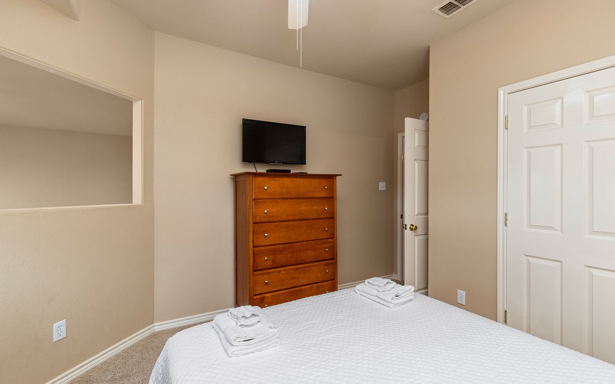 Your comfortable bedroom features crisp linens, elegant furnishings, and modern amenities for a perfect night's rest.