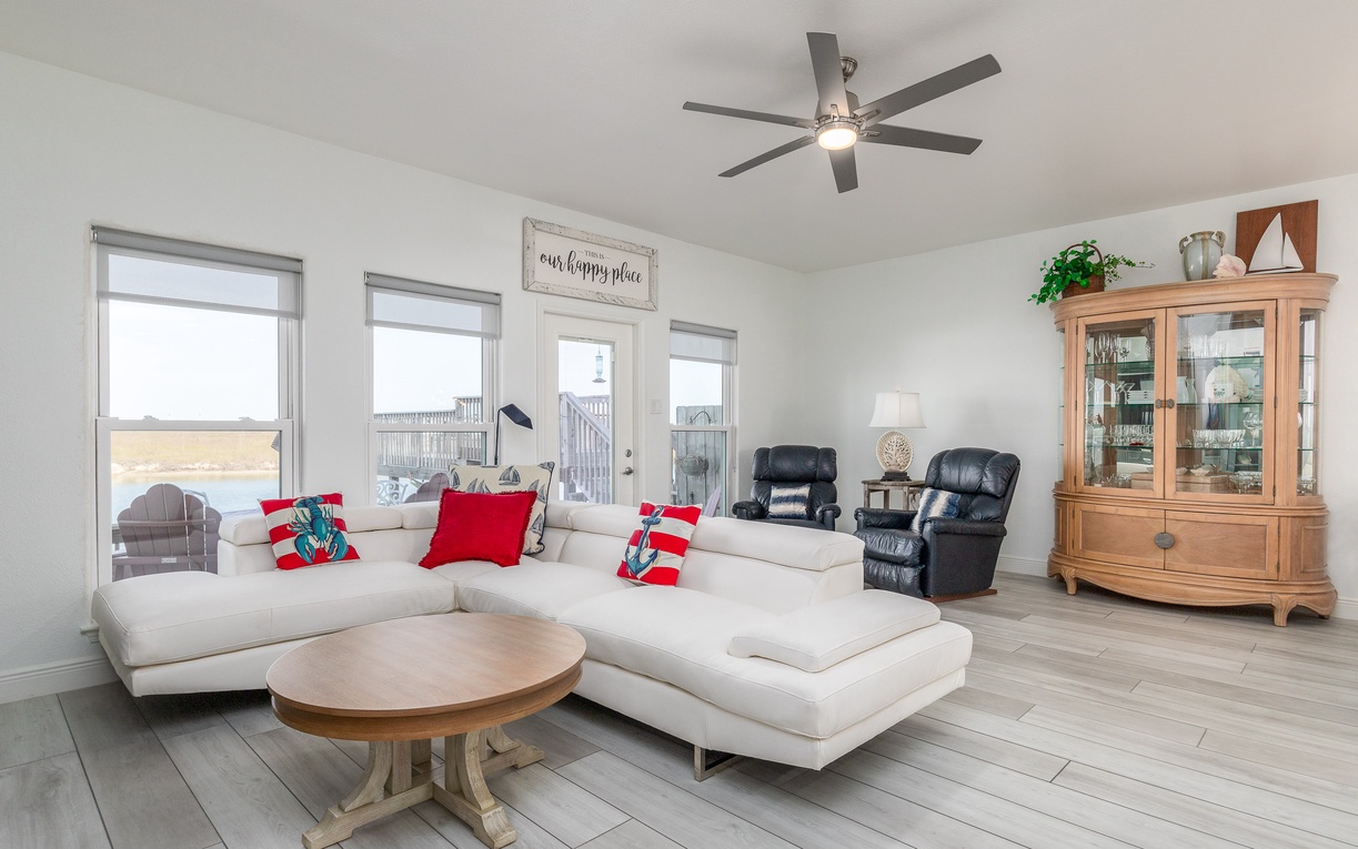 Sink into plush sectional seating where festive touches and coastal breezes create your perfect holiday retreat.